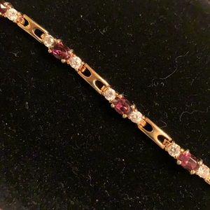 Vtg Gold tone rhinestone, purple stone bracelet.